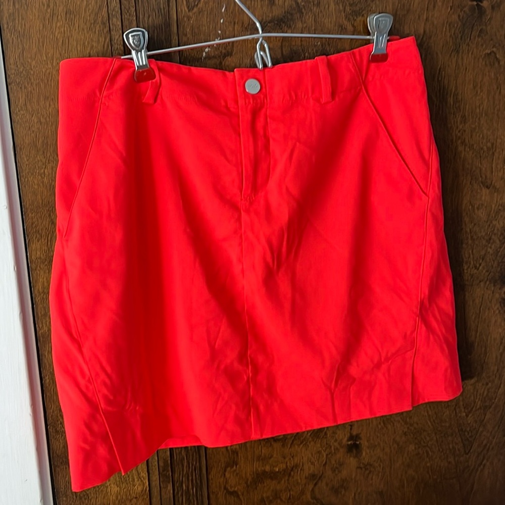 Polo golf orangy red golf skirt. Size 4.